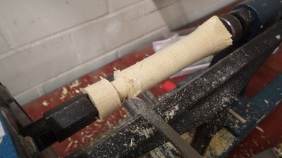 after roughing out a cylinder, use a parting tool to make a tenon that will fit into the ferrule