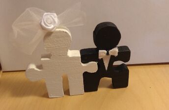 Painted wedding figures for cake decoration.