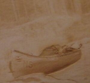 Grayscale canoe on wood.jpg