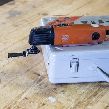 oscillating tool: can be equipped with triangular sanding pads that reach into very tight corners