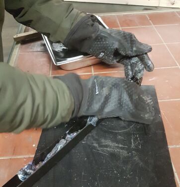 filling the mold with heat-resistant gloves