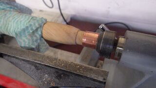 a sturdy tailstock on the wood lathe can help to press the ferrule onto the tool handle