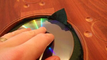 for nice and even adhesion in a round cutout, it works well to apply pressure with something round (like a CD)