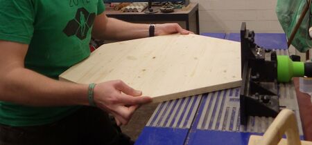 chamfering the edges of the 6-player board on the router table
