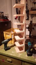 fully assembled shelf with cordless drills (one for drilling, one for screwing)