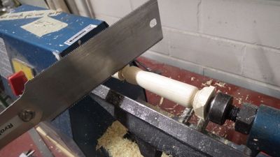 cut off excess material and take the handle off the lathe