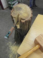 chopping out the excess with a bevel edge chisel